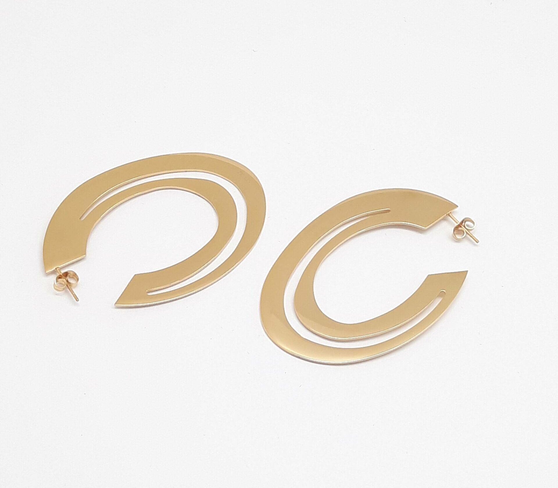 Orbit statement hoop earrings in electroplasma gold