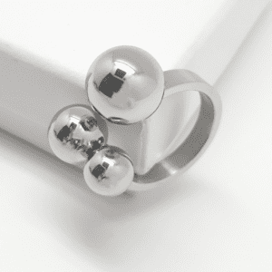 Sculptural statement ring with three floating spheres in steel