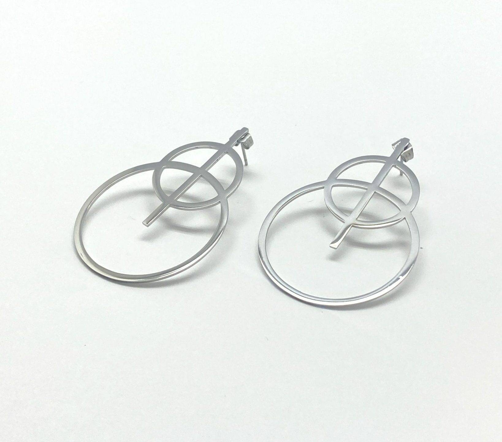 Celestial statement earrings with sacred cross design in steel