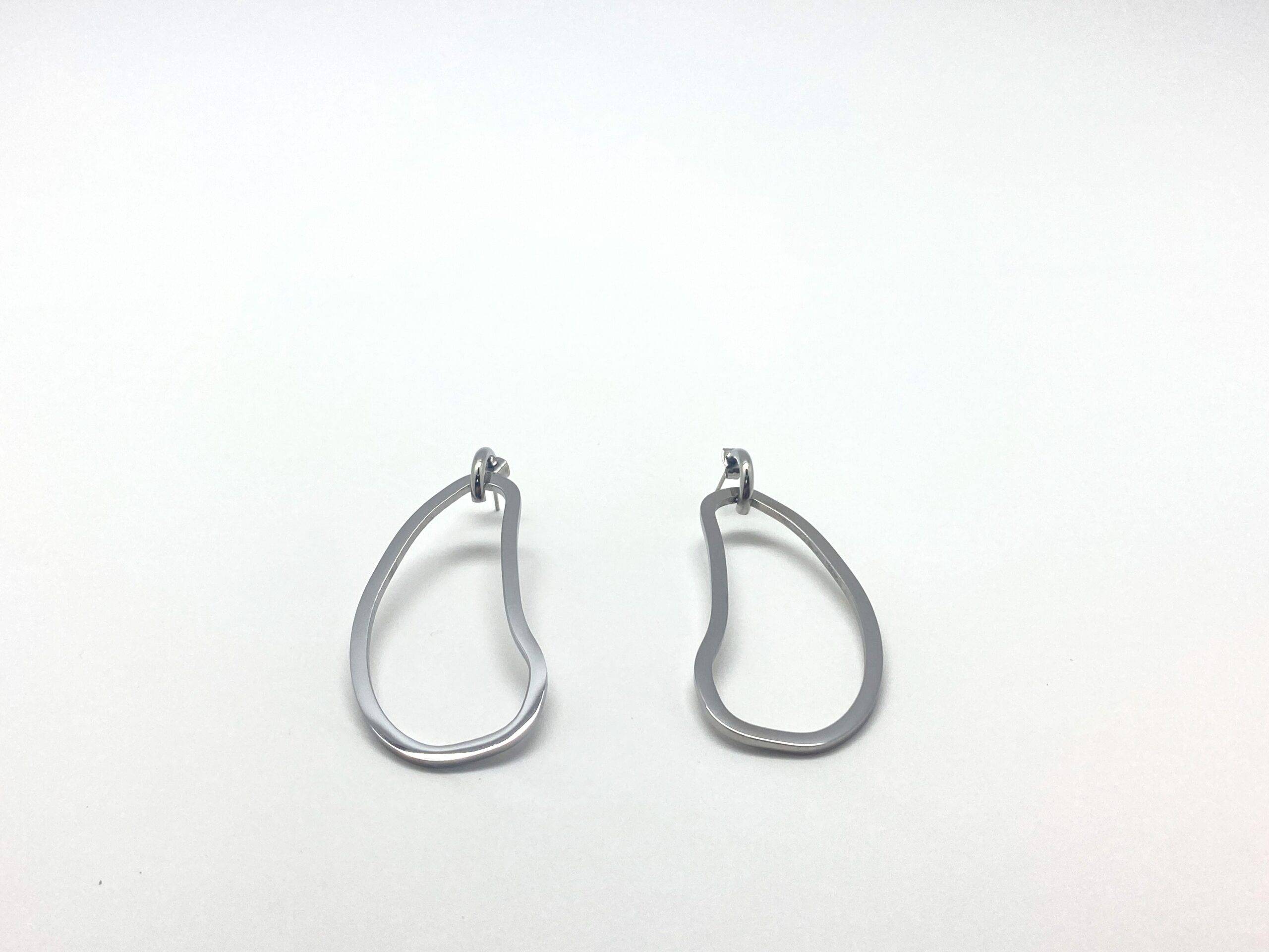 Sculptural drop earrings with fluid curves in stainless steel