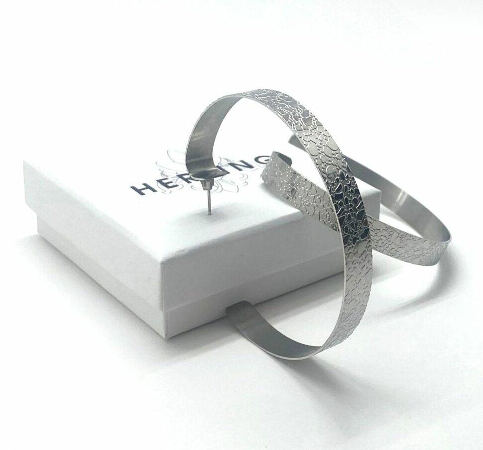 Hammered hoop earrings in textured steel