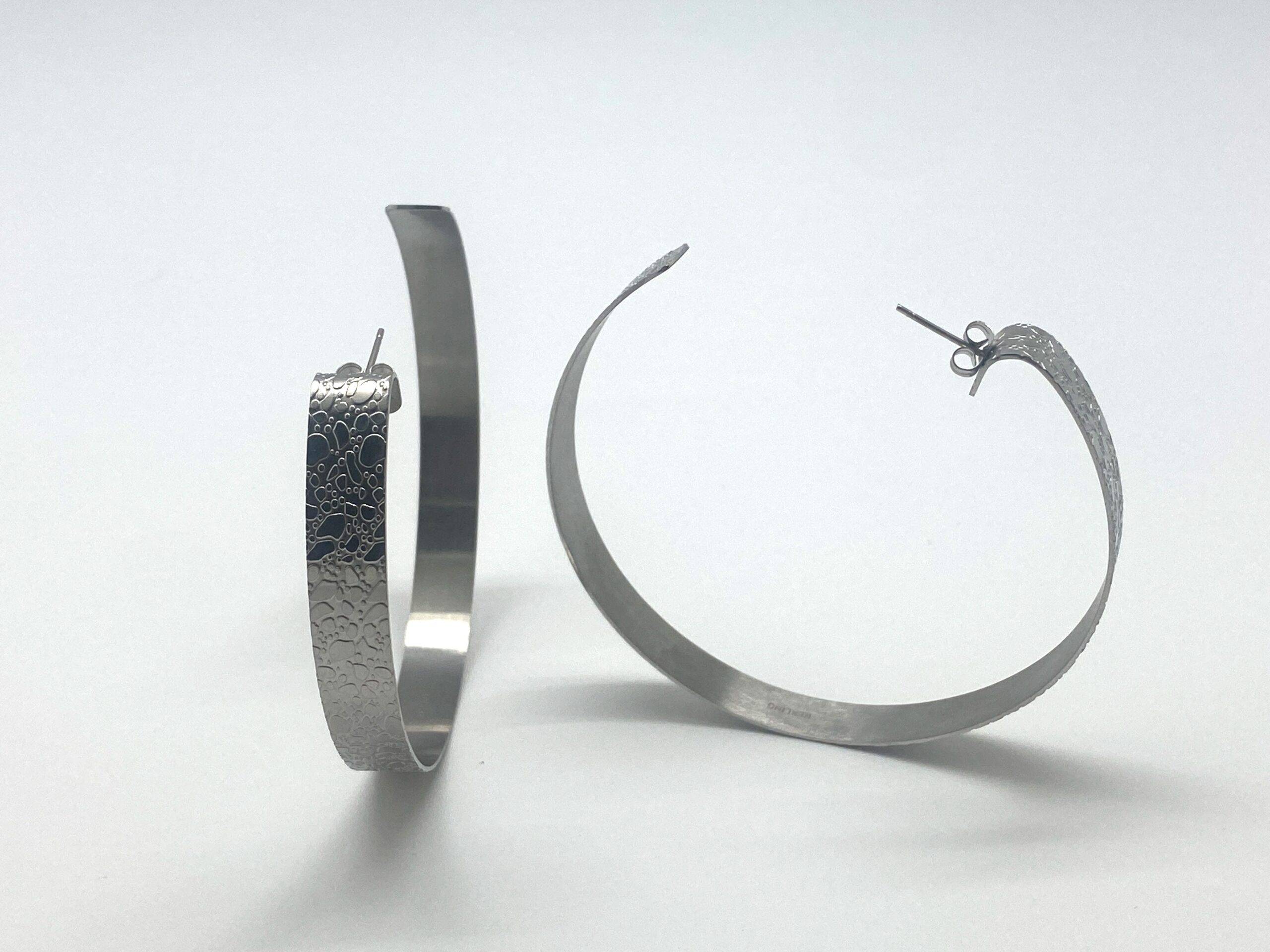 Hammered hoop earrings in textured steel