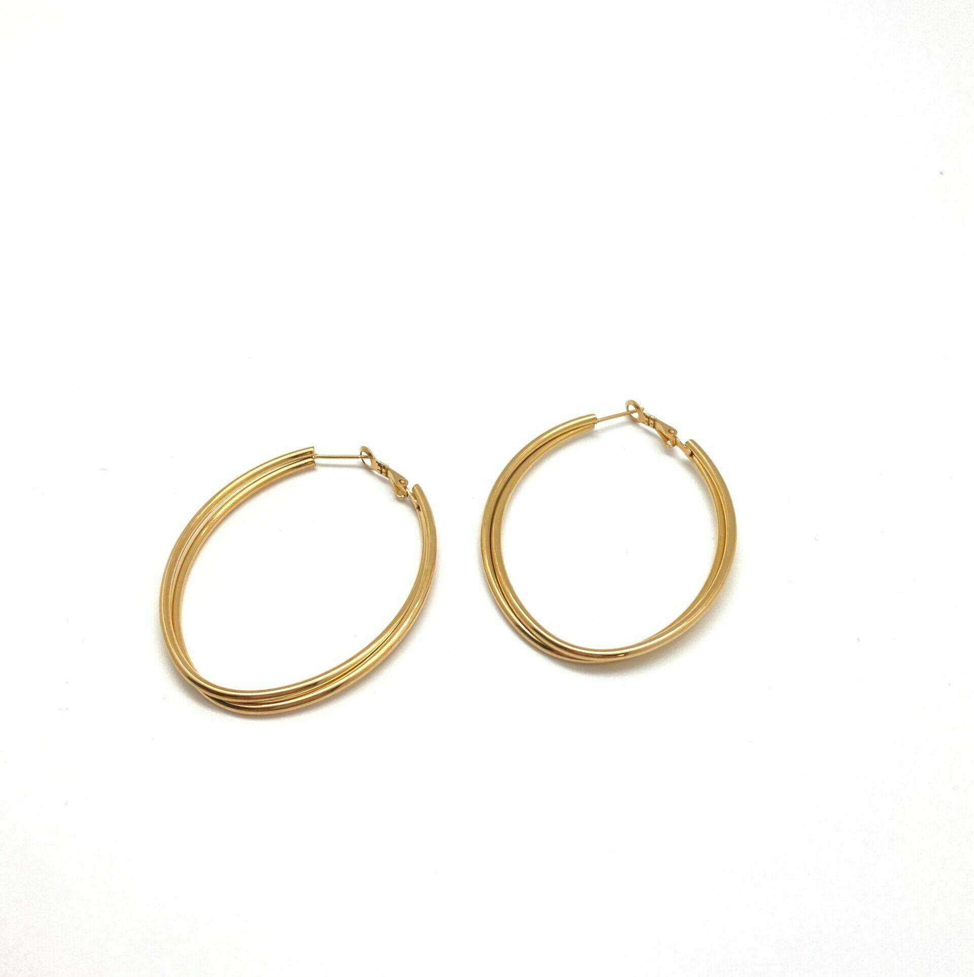 Eclipse textured hoop earrings in electroplasma gold