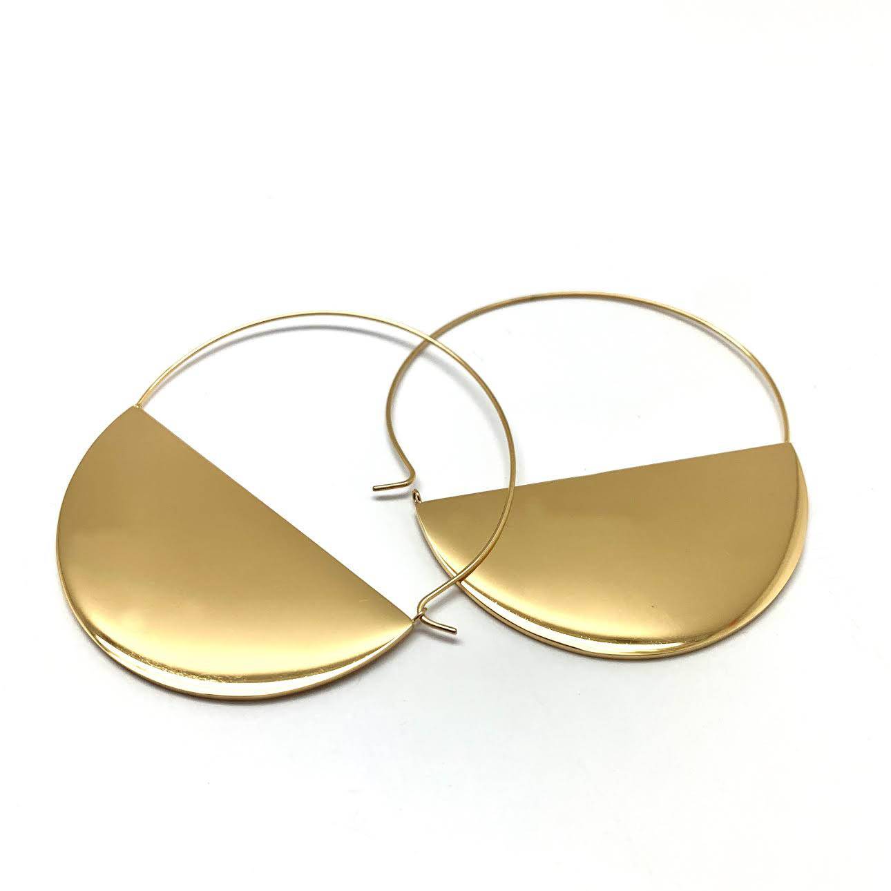 Electroplasma gold-plated half moon earrings with a bold geometric silhouette.