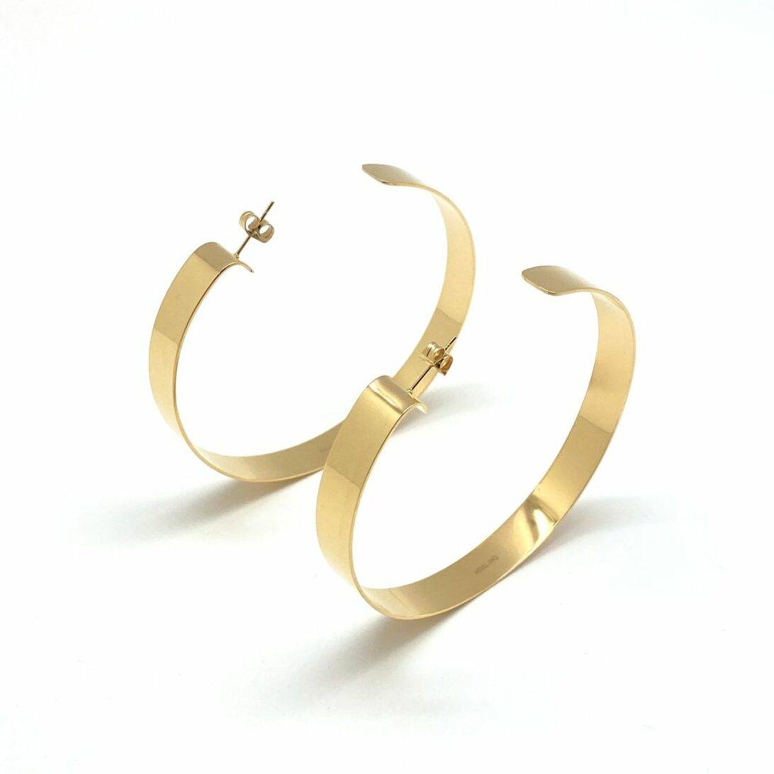 Gold big hoop earrings with modern design