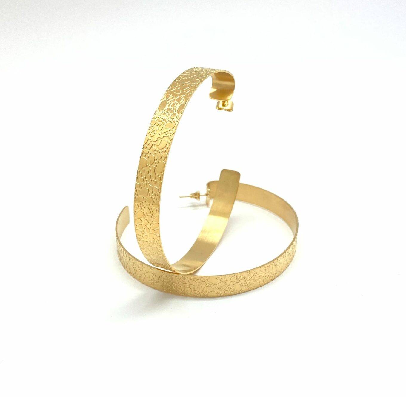 Gold hammered hoop earrings with texture