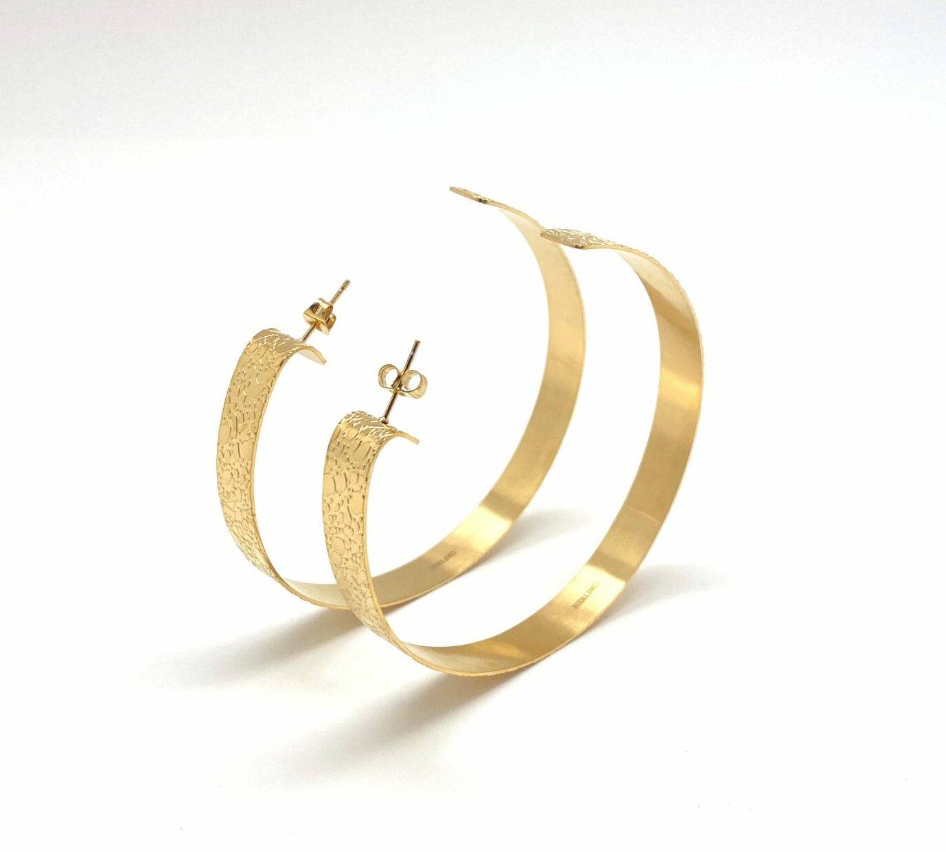 Gold hammered hoop earrings with texture