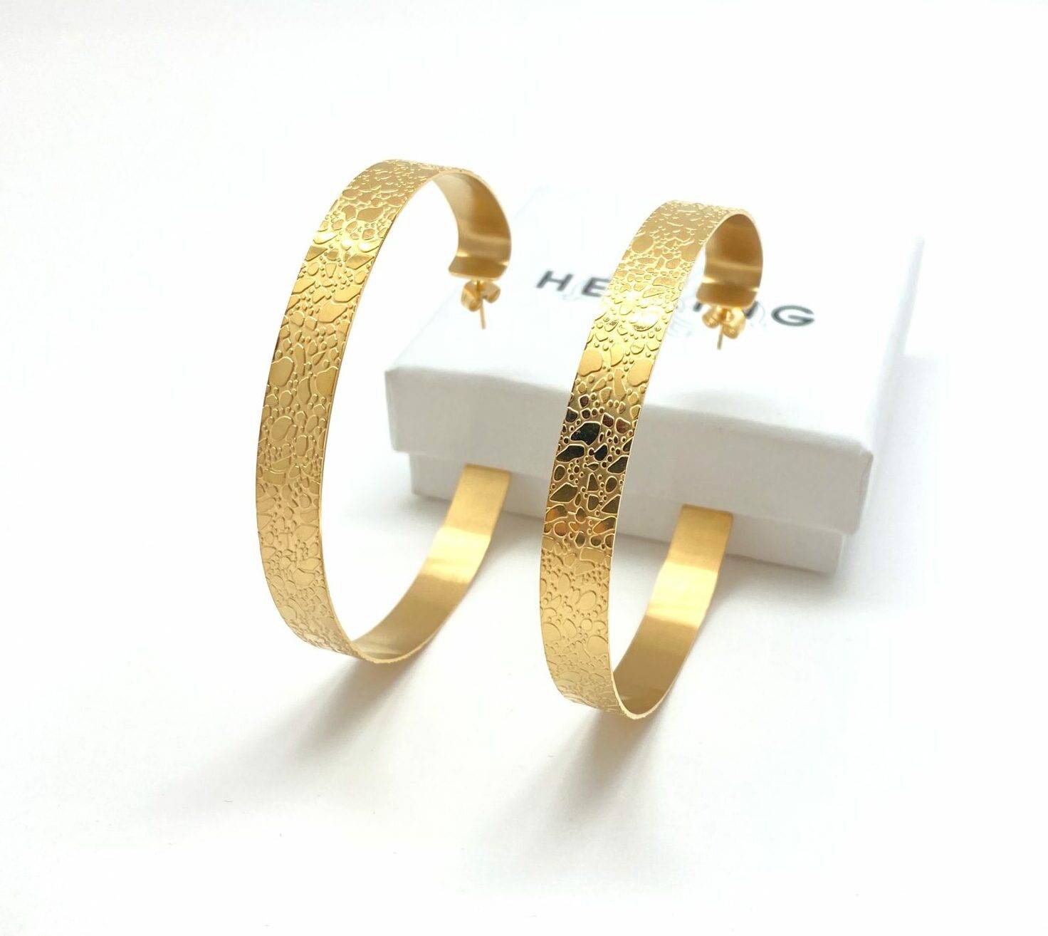 Gold hammered hoop earrings with texture