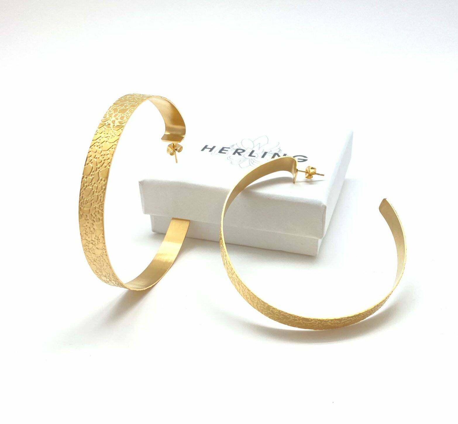 Gold hammered hoop earrings with texture