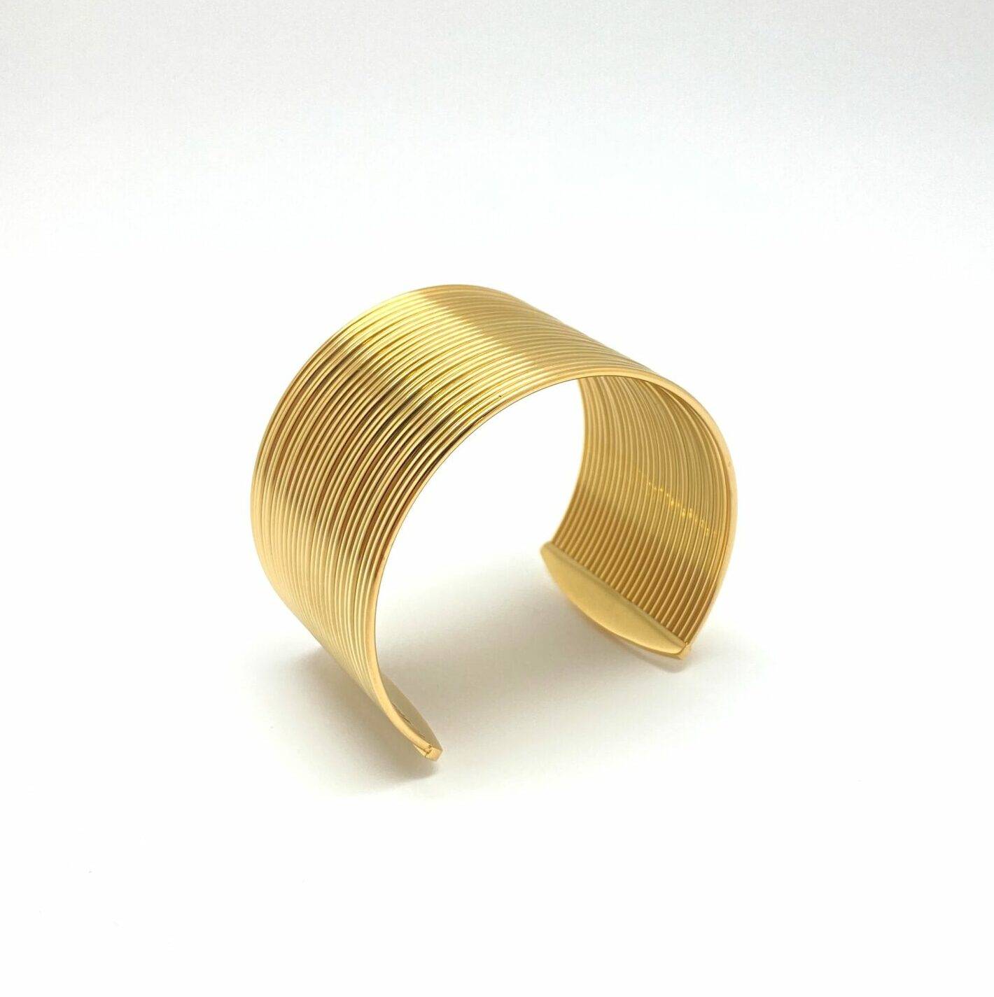 Gold textured cuff bracelet with parallel ripple design