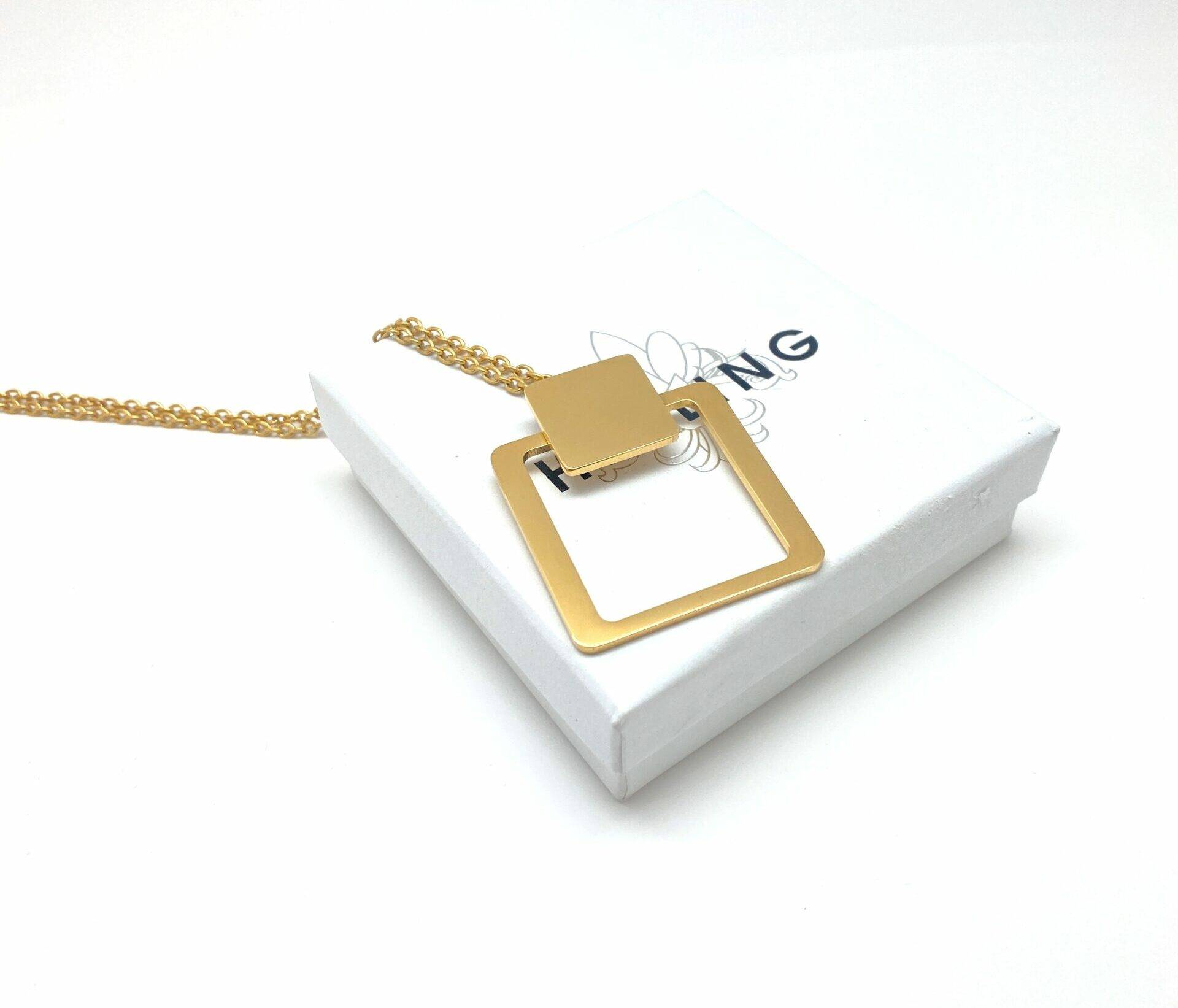 Gold square pendant necklace with modern design