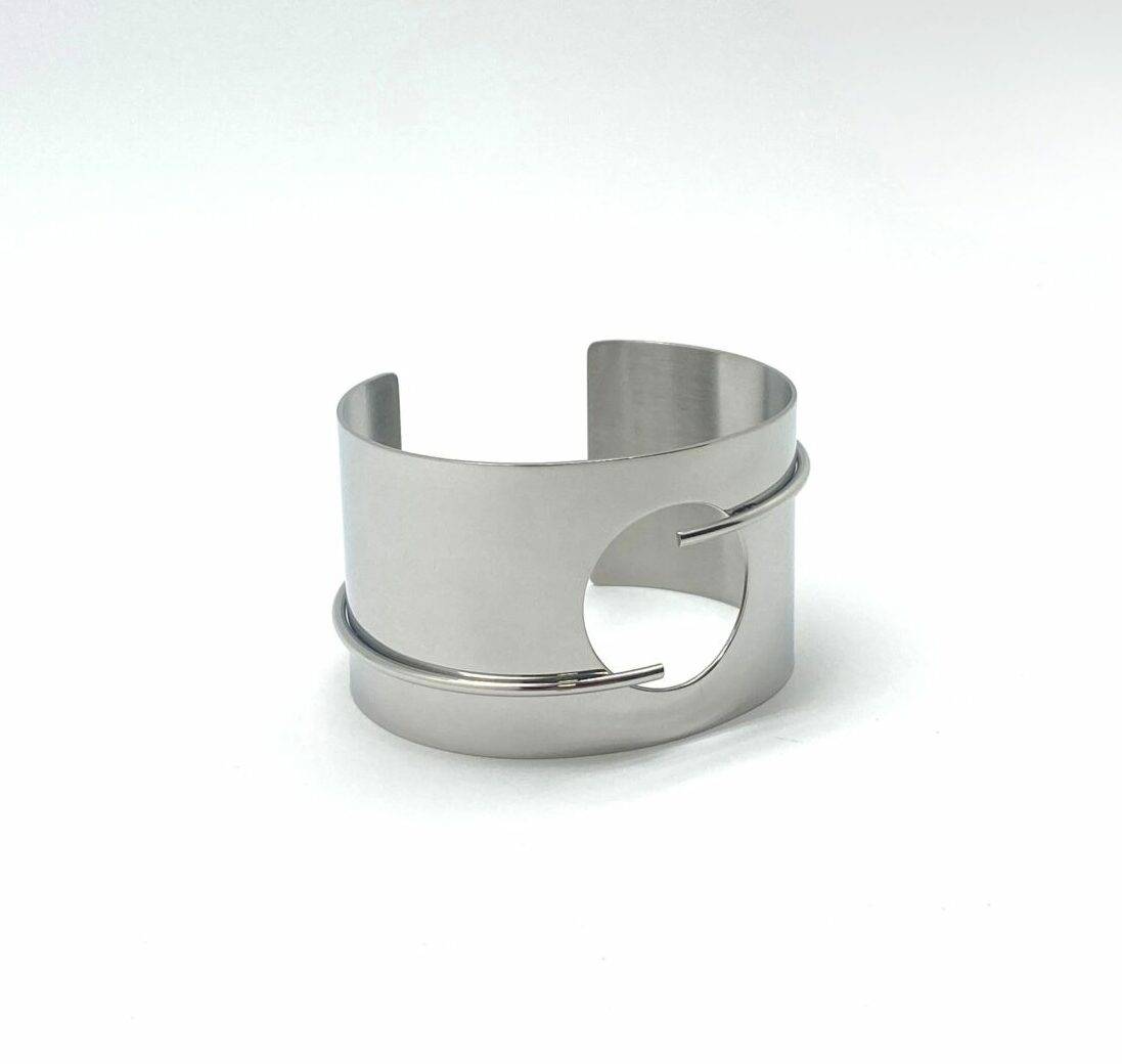 Modern cuff bracelet with circular cutout design in premium stainless steel