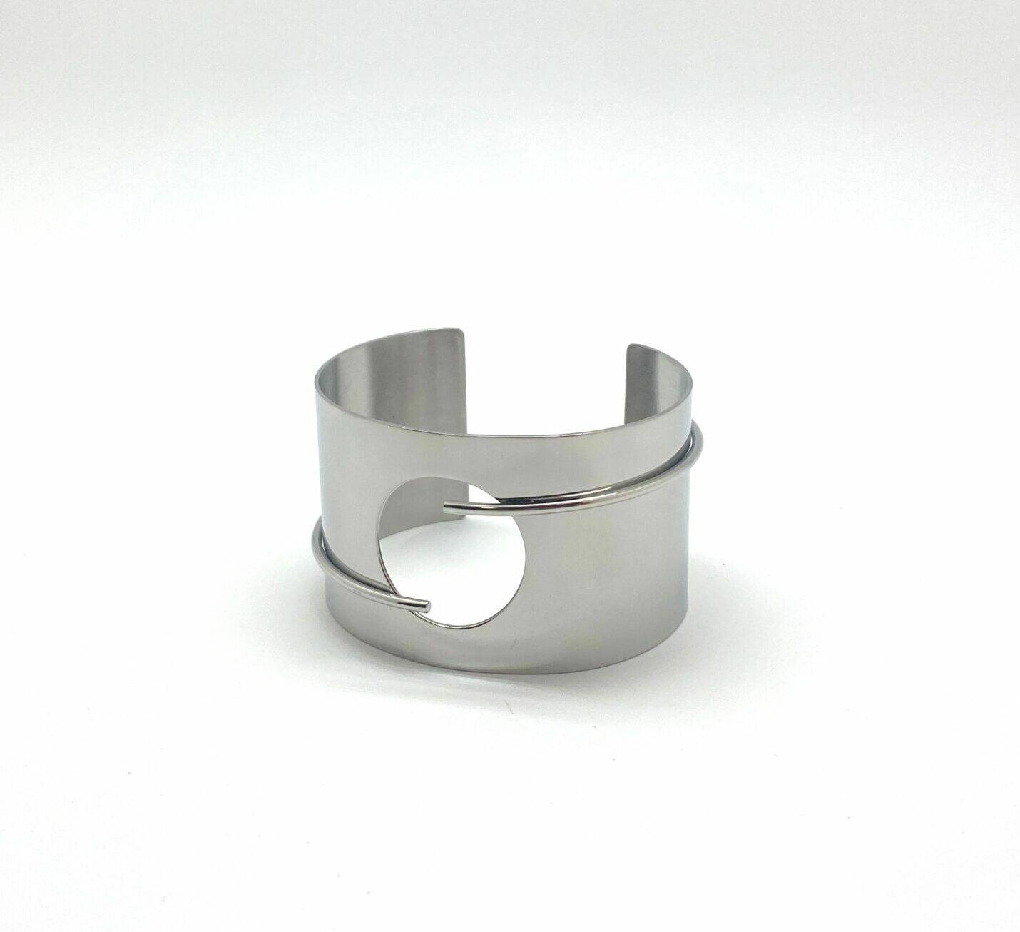 Modern cuff bracelet with circular cutout design in premium stainless steel