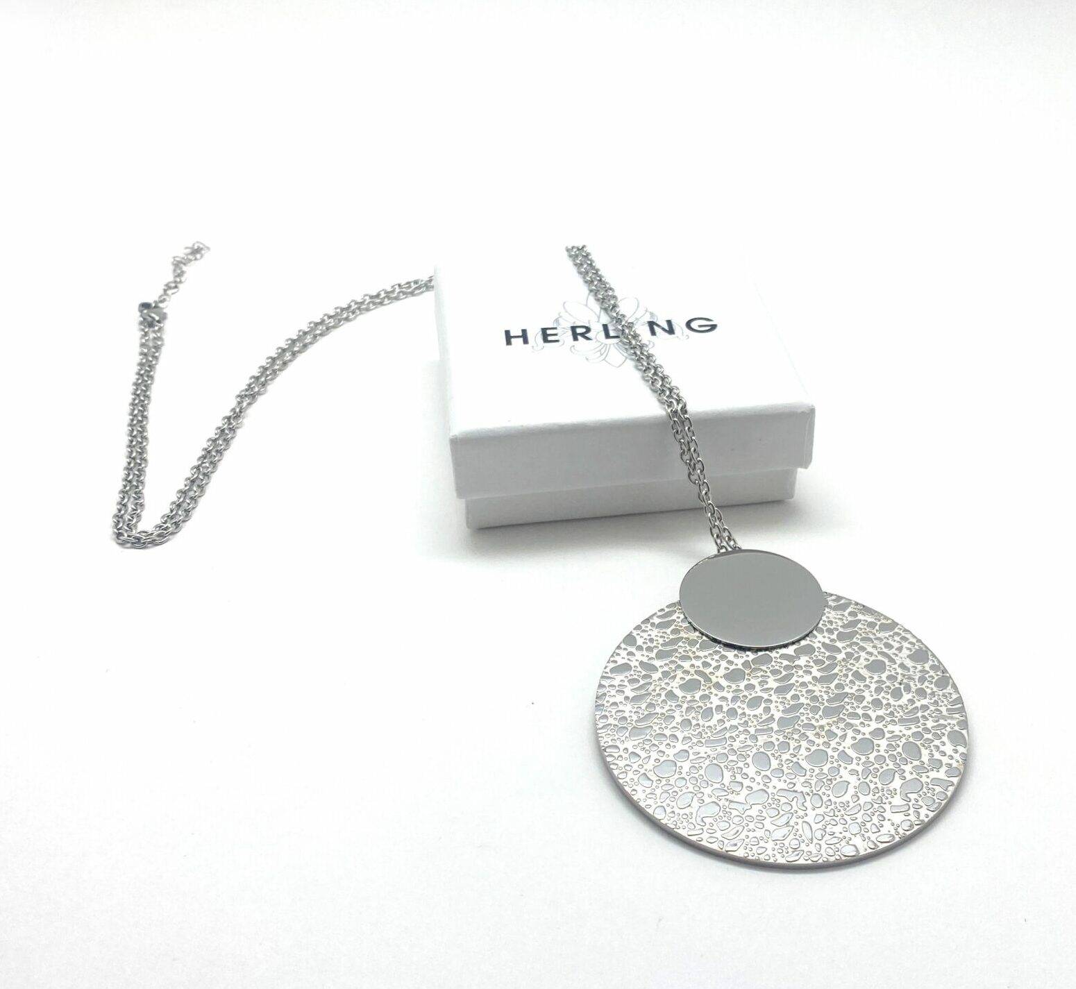 Long pendant necklace with textured disc in steel