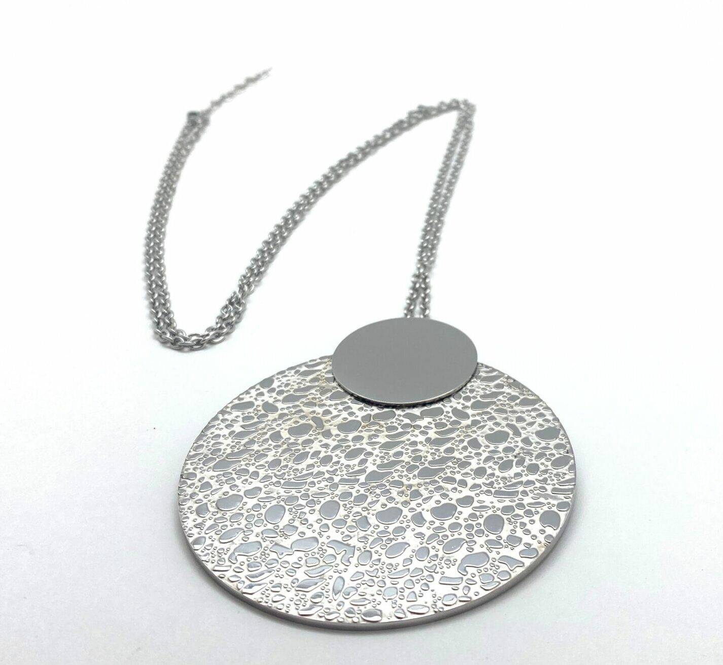 Long pendant necklace with textured disc in steel